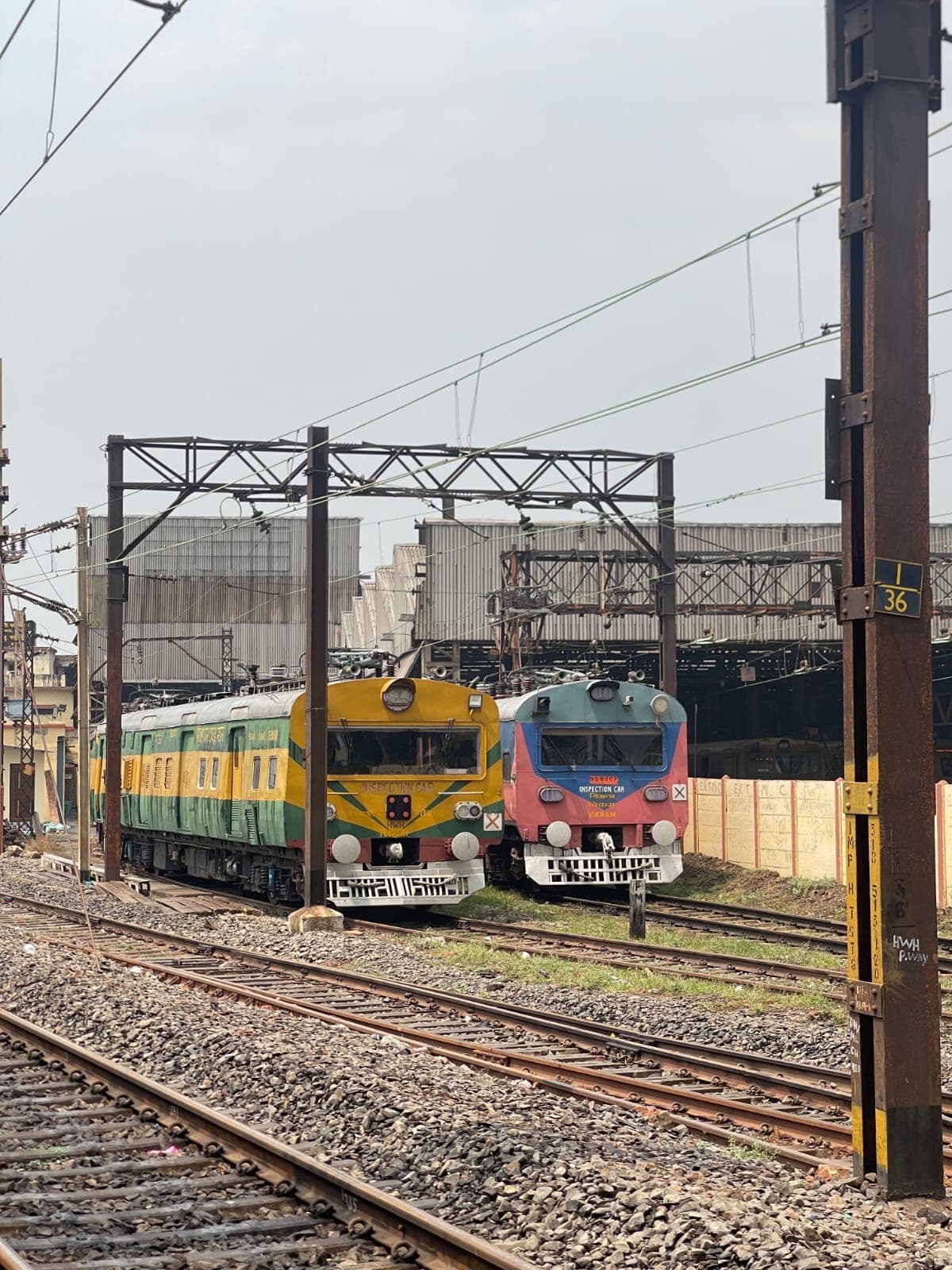 Self-propelled railway inspection cars stabled in a marshalling yard
